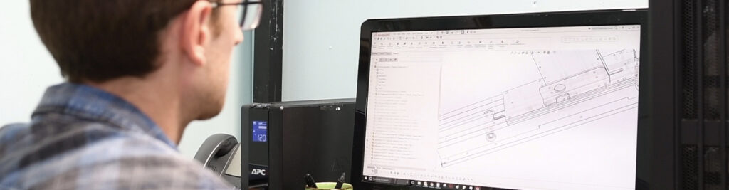 engineer working on a computer on a medical packaging design